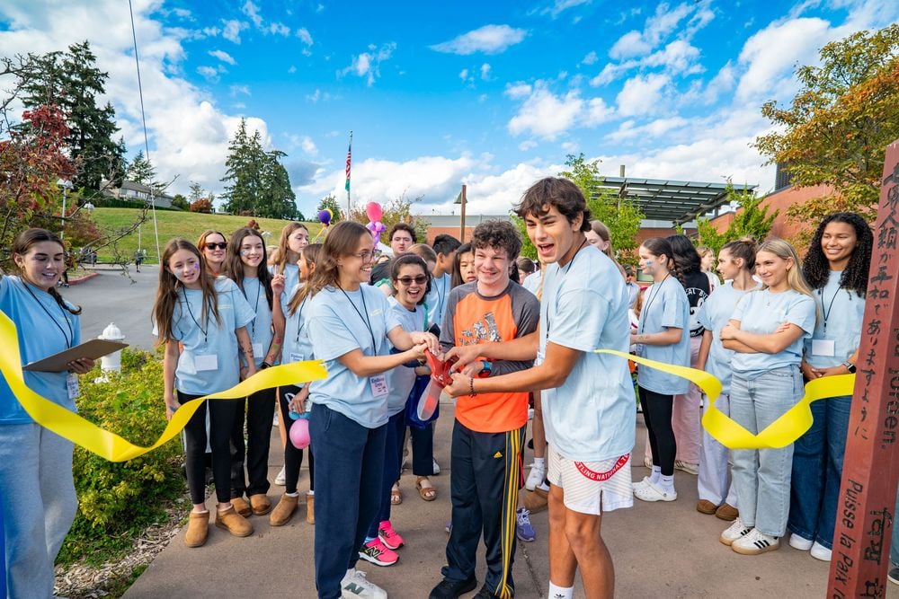 Kindness Crew cutting the ribbon at Community Kindness Day & Walk